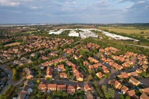 Aerial view of a neighbourhood of houses with red roofs in England